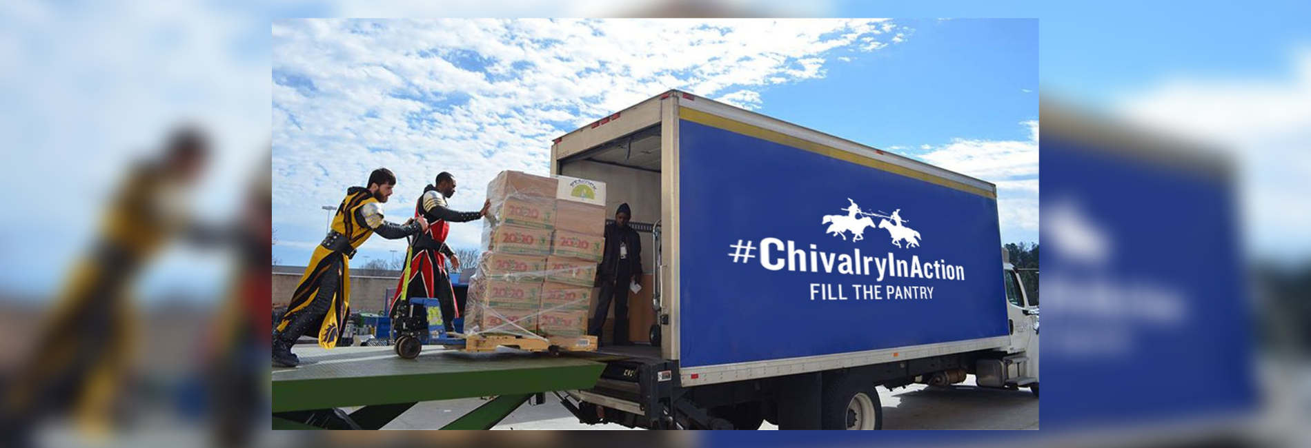 Knights help load a truck with donations.