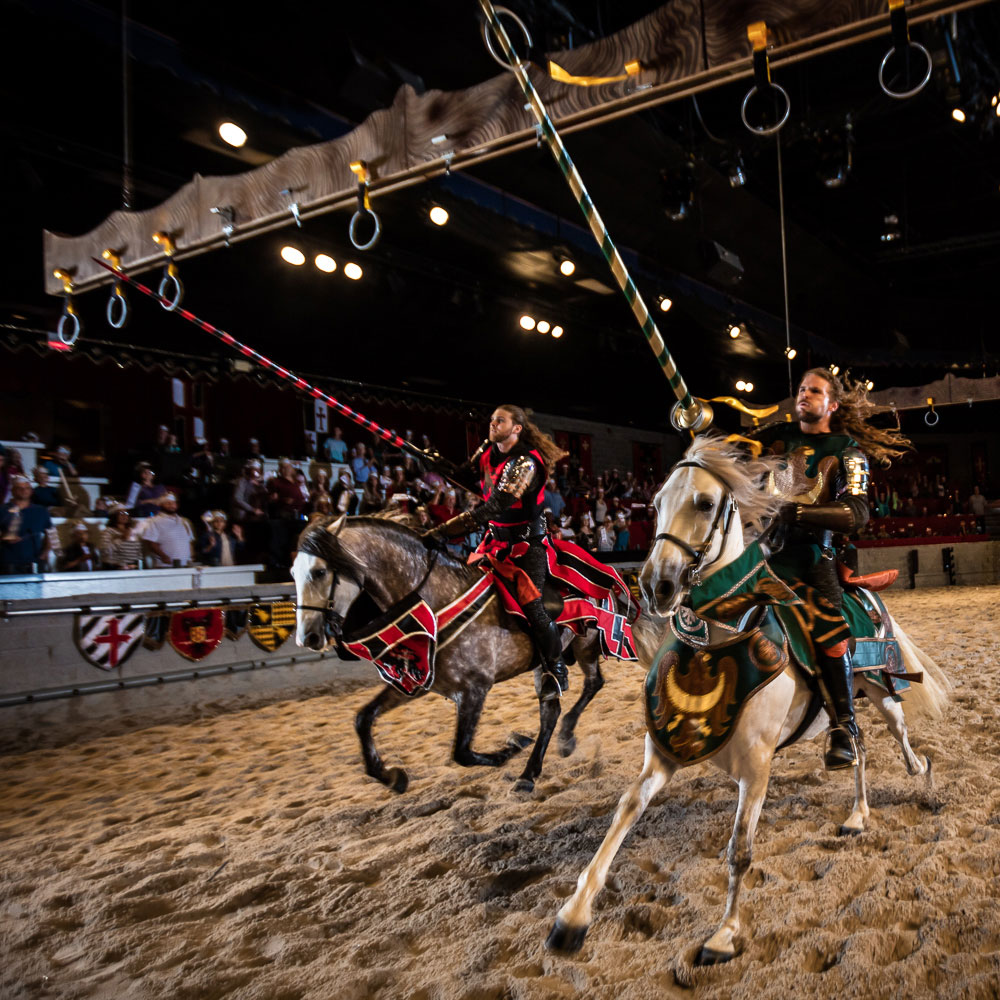 Two knight on horseback compete in big rings game