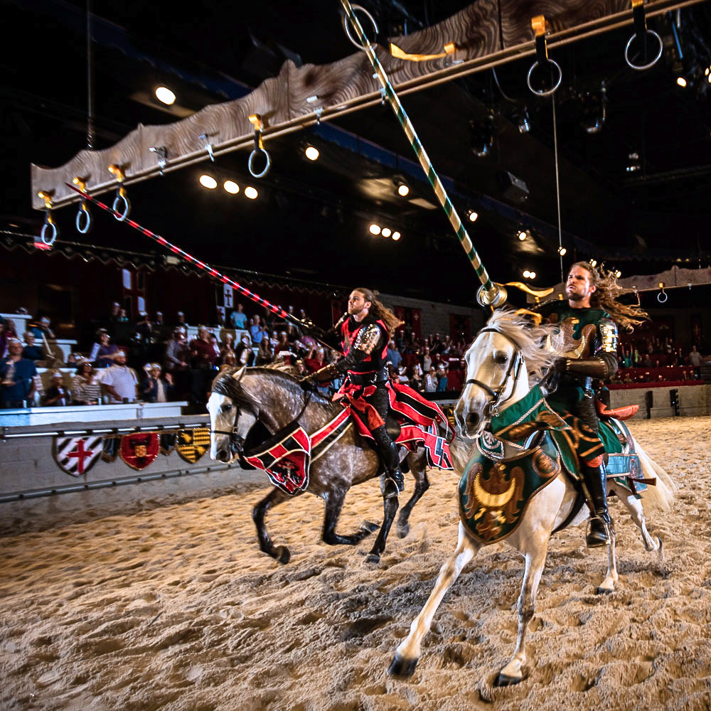 Two knights on horseback compete in the big rings game.