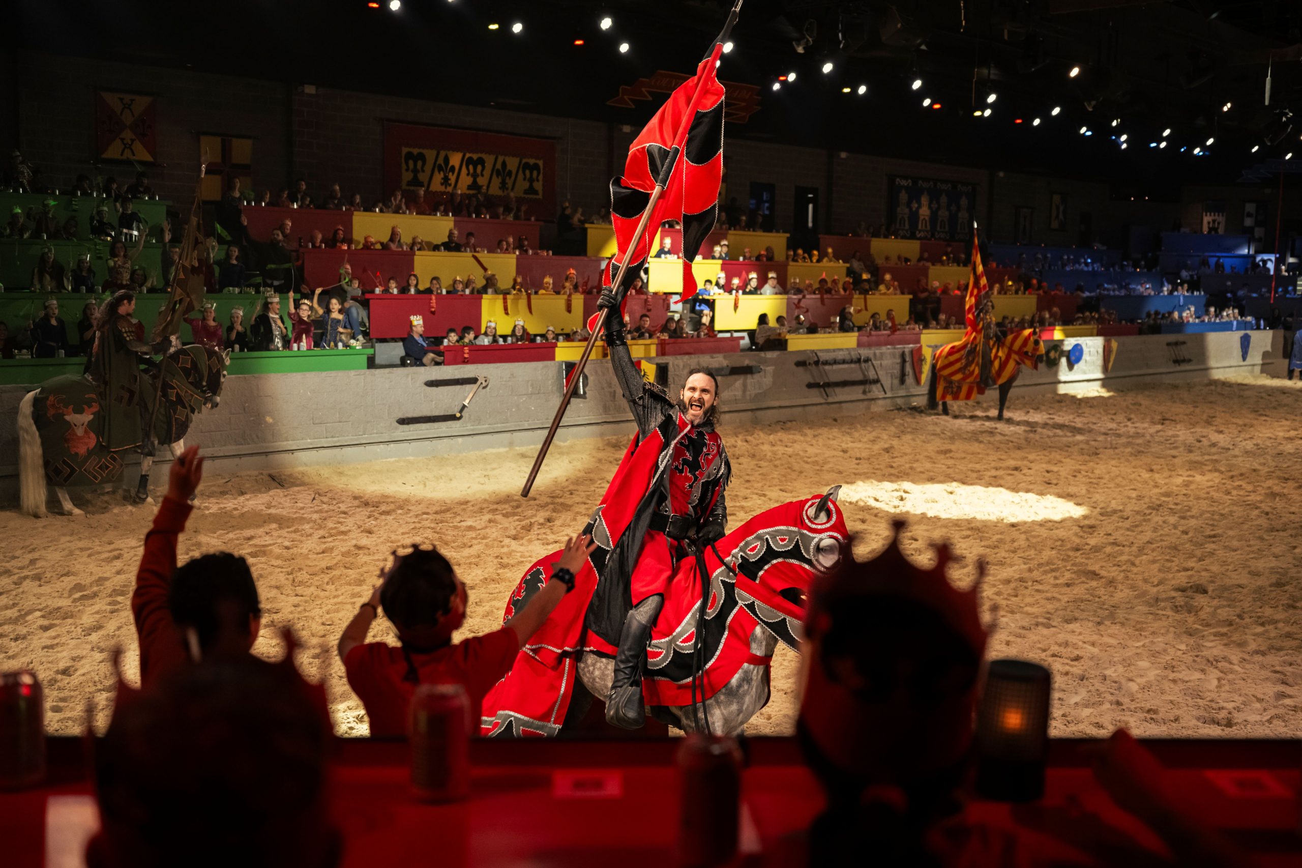 Medieval Times Red Knight Cheers with Crowd